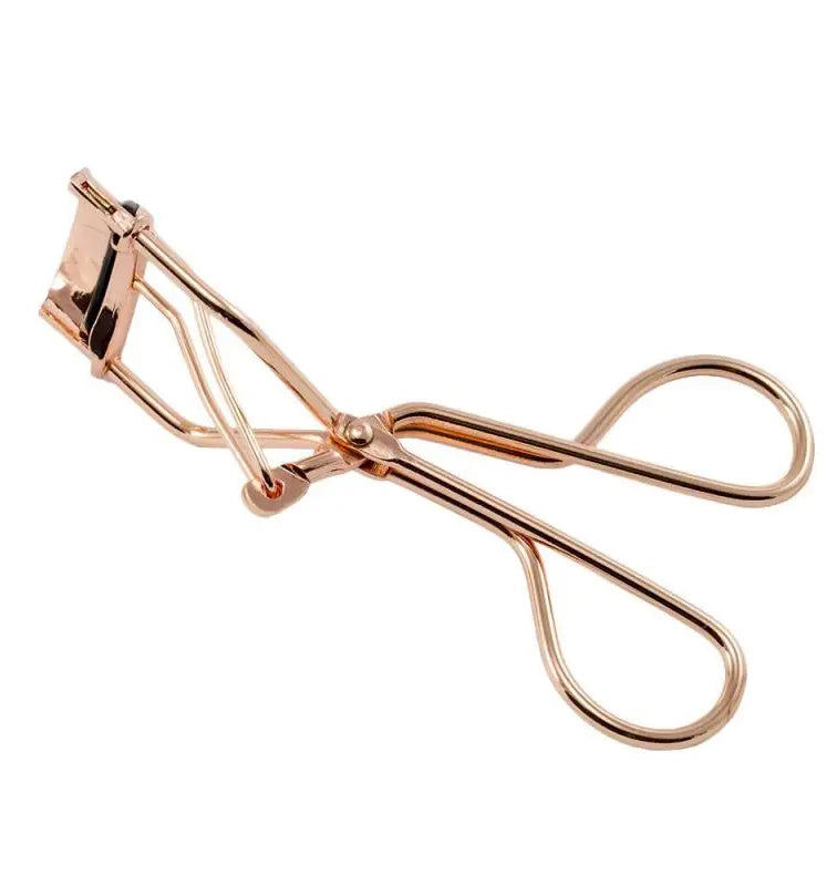 Wimpernzange aus Edelstahl. Wimpernformer, Eyelash Curler. Zange in rose - gold Farbe